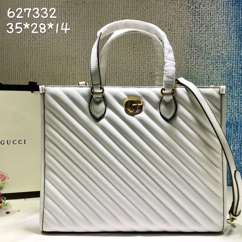 G*u*i shopping bags